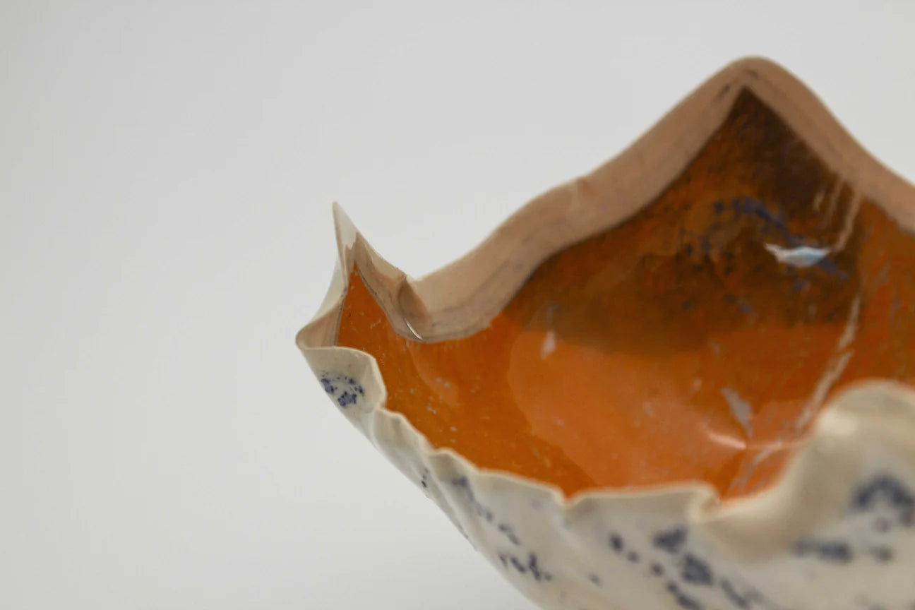Porcelain Bowl with with four corners.