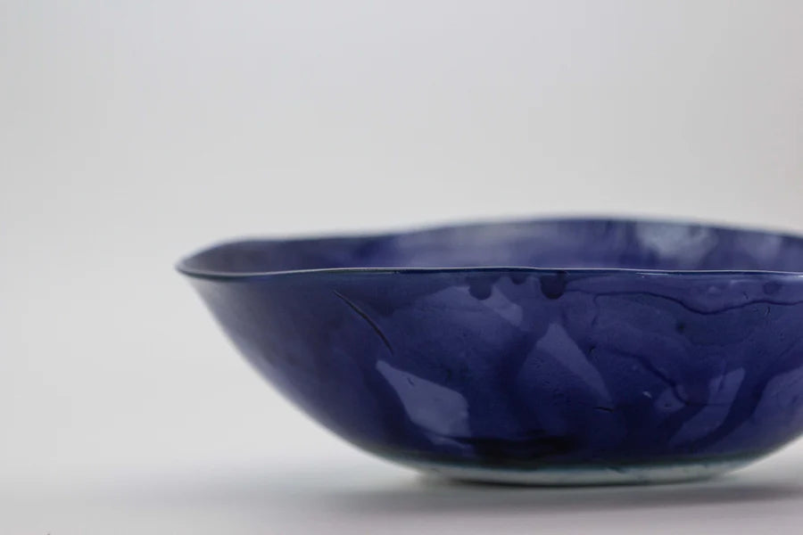 Blue porcelain bowl with sketches.